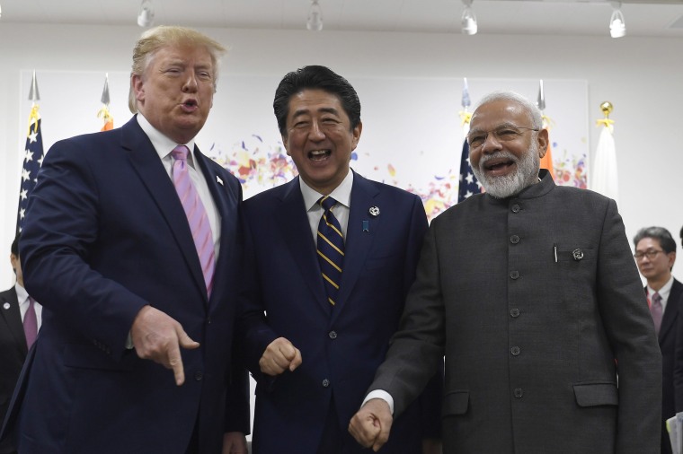 Image: President Donald Trump, Japanese Prime Minister Shinzo Abe, center, and Indian Prime Minister Narendra Modi, right, share a laugh at the start of their meeting on the sidelines of the G-20 summit in Osaka