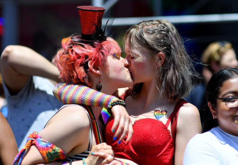 Image: A couple shares a kiss during the New York's Pride March on June 30.