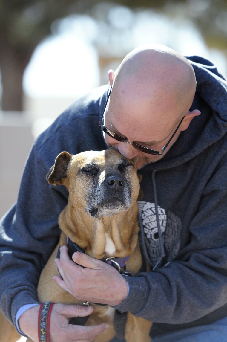 Kevin Johnson works with Layla at the Parrot Garden at Best Friends Animal Sanctuary