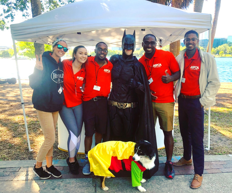 Batman and Robin, aka Chris Van Dorn and Mr. Boots, volunteer together.