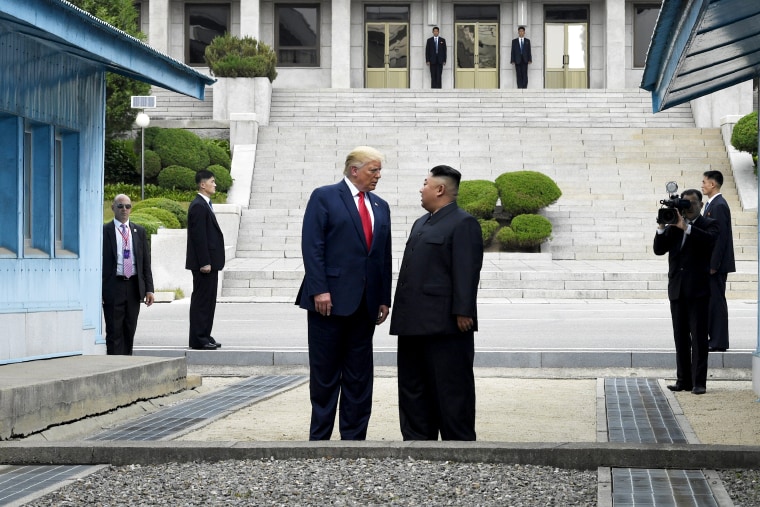 Image: President Donald Trump and North Korean leader Kim Jong Un stand on the demilitarized zone in North Korea on June 30, 2019.