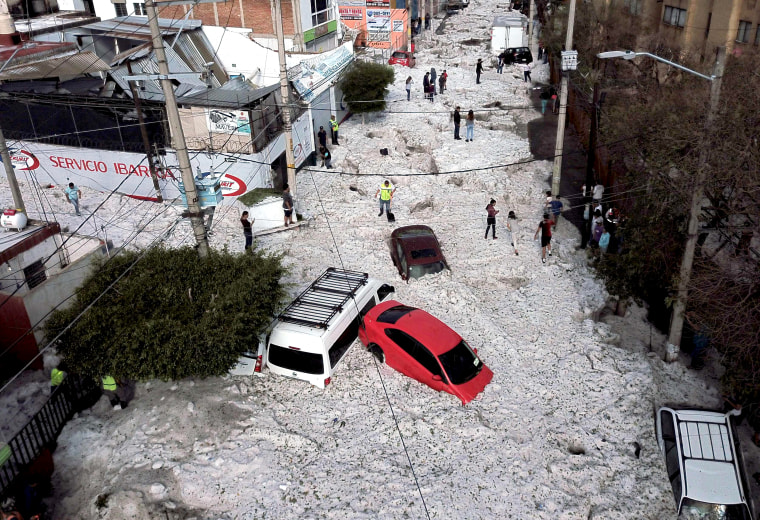Image: Vehicles are buried under hail in Guadalajara, Mexico, on June 30, 2019.