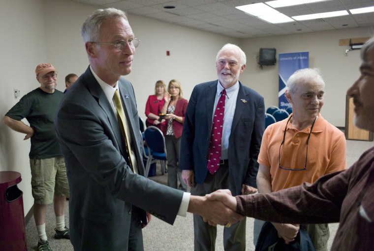 Image: University of Alaska presidential candidate Dr. Jim Johnsen, left, greets representatives in Juneau, Alaska, in 2015.