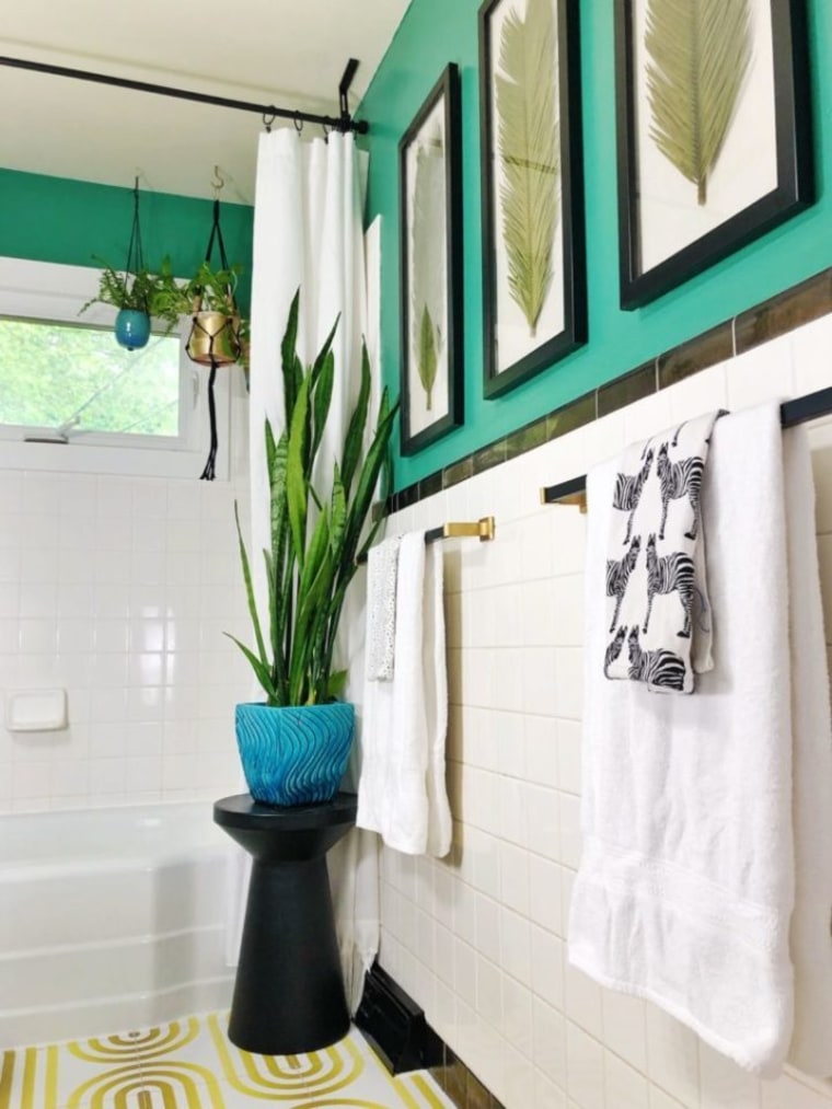 These three framed leaves were the inspiration behind the bathroom's new design.