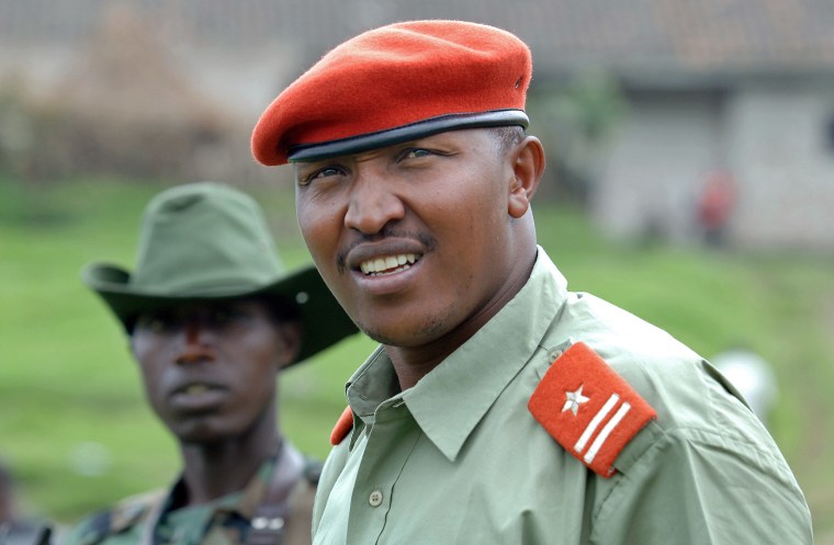 Image: General Bosco Ntaganda, self declared leader of the National Committee for the Defense of the People (CNDP), escorted by comrades at his mountain base in Kabati, Democratic Republic of Congo
