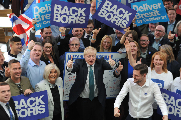 Image: Boris Johnson poses with supporters before a Conservative Party event in Perth, Scotland, on July 5.