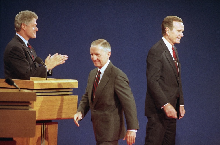 Independent presidential candidate Ross Perot walks toward his position on stage after greeting Democratic candidate Bill Clinton, left, and President Bush prior to a debate in St. Louis on Oct. 11, 1992.