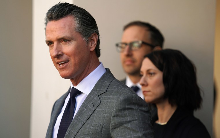 Image: Gov. Gavin Newsom is surrounded by several California mayors after having a meeting with them to discuss affordable housing