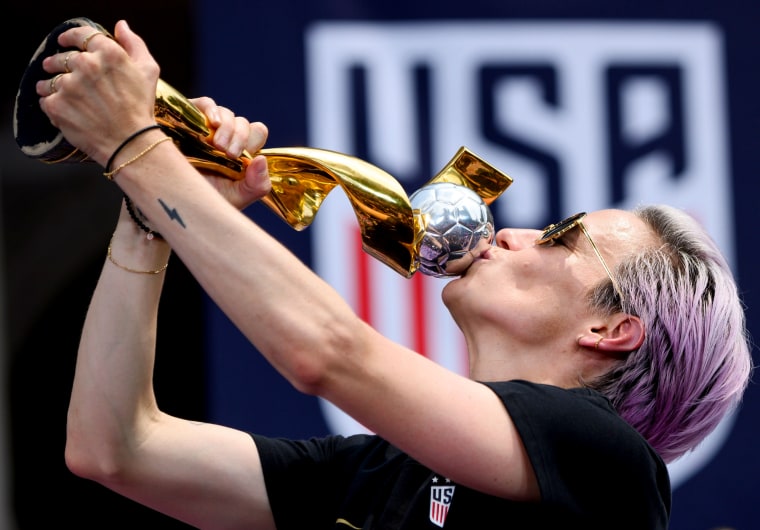 Image: Megan Rapinoe kisses the World Cup trophy during a ceremony at City Hall in New York on July 10, 2019.
