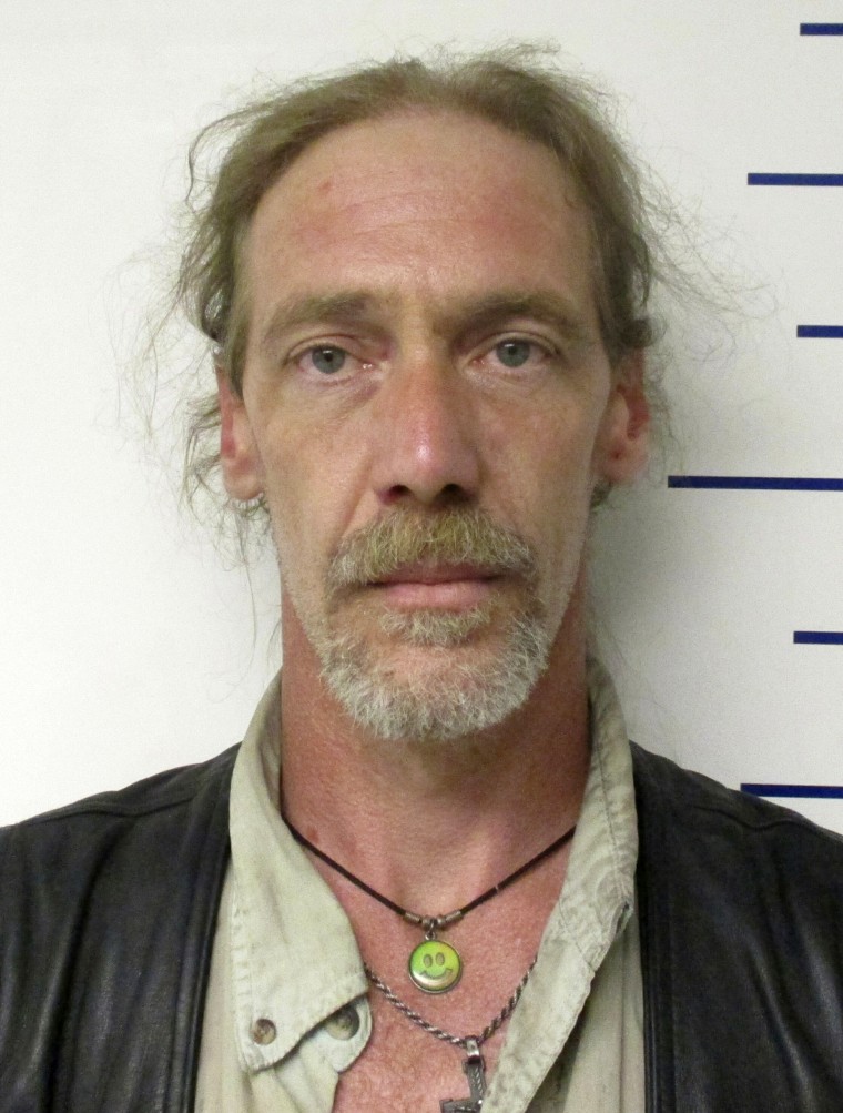 Image: Stephen Jennings was arrested after finding a rattlesnake, a canister of radioactive uranium and an open bottle of Kentucky Deluxe whiskey during a traffic stop in Guthrie, Oklahoma.
