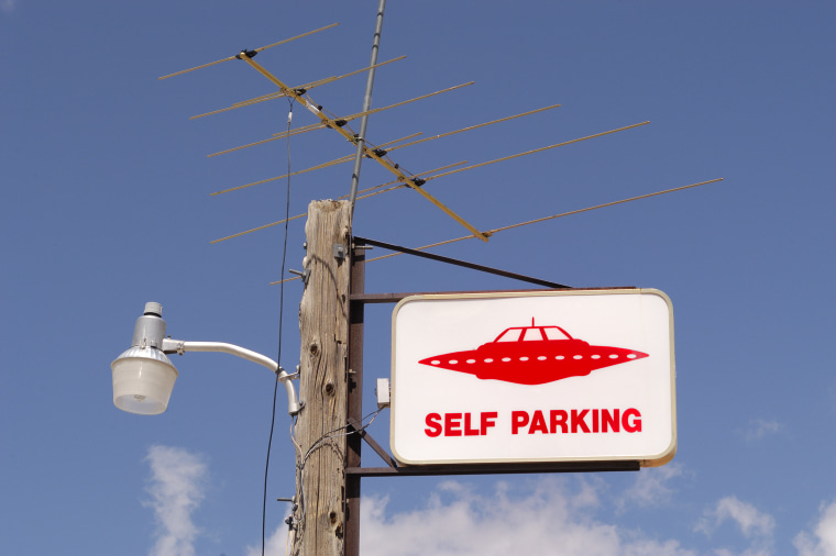 Image: UFO Parking Sign, gas station,