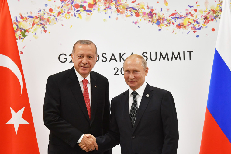 Image: Russian President Vladimir Putin greets Turkish President Recep Tayyip Erdogan on the sidelines of the G20 leaders summit in Osaka, Japa