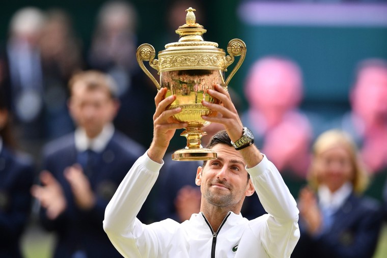 Image:Serbia's Novak Djokovic raises the winner's trophy after beating Switzerland's Roger Federer during their men's singles final