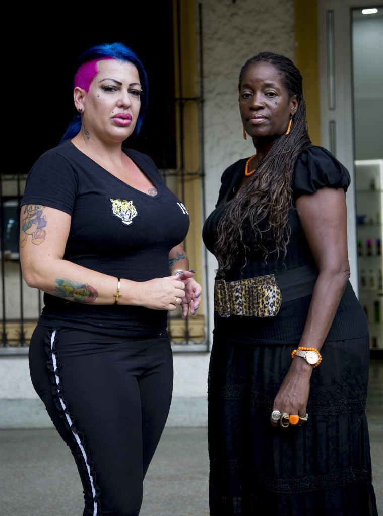 Image: Dianelys Alfonso, left, singer stands with her lawyer Deyni Terry, for a photo during an interview with The Associated Press in Havana, Cuba.