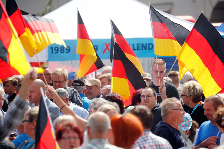Image: People attend an election campaign event by Germany's far-right Alternative for Germany (AfD) party in Cottbus,