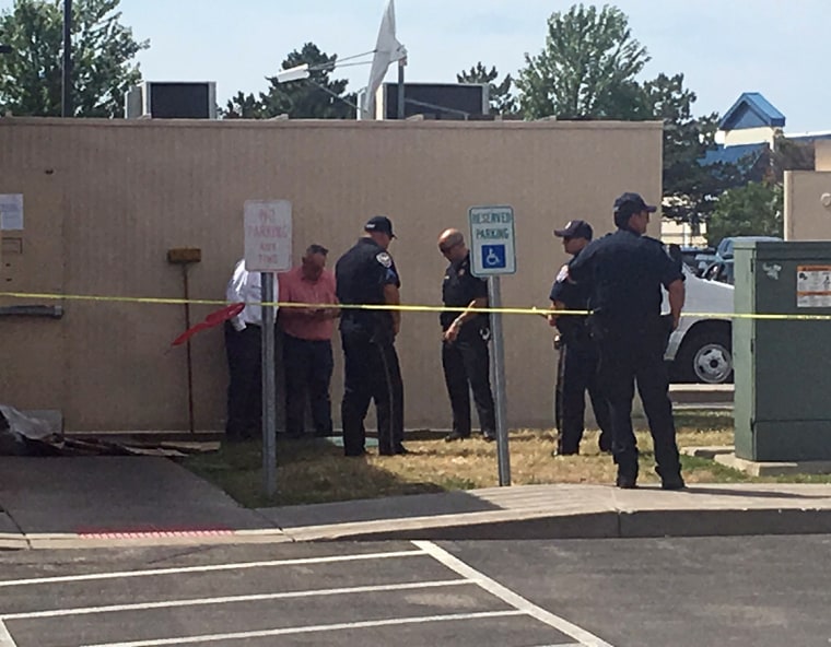 Police examine the area where a 3-year-old boy fell into a grease trap in Rochester, New York.