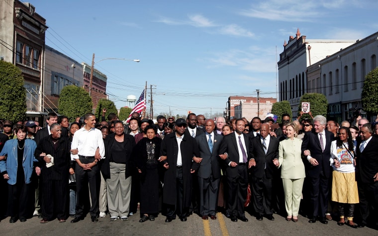 Image: Barack Obama and Hillary Clinton march with a crowd to the Edmund Pettus Bride to commemorate the 1965 Bloody Sunday voting rights march in Selma, Alabama, on March 4, 2007.