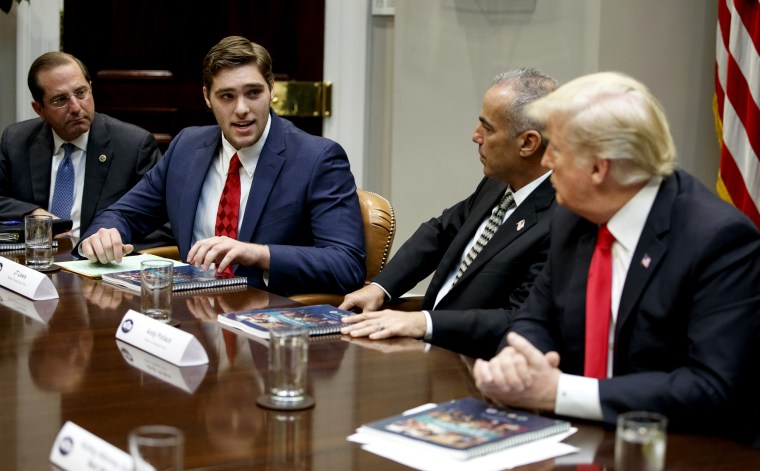 Image: JT Lewis, left, the brother of Sandy Hook victim Jesse Lewis, speaks to President Donald Trump during a round table discussion on school safety at the White House on Dec. 18, 2018.