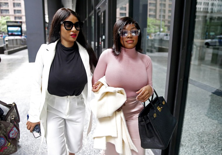 Image: Azriel Clary and Joycelyn Savage, supporters of R. Kelly, leave after his arraignment at the Dirksen Federal Building in Chicago on July 16, 2019.