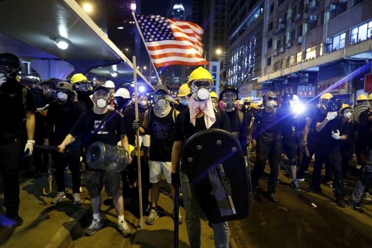 Image: Protesters prepare to confront riot police in Hong Kong on July 21, 2019.