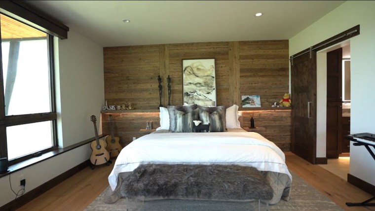 The bedroom features mechanical blackout shades.