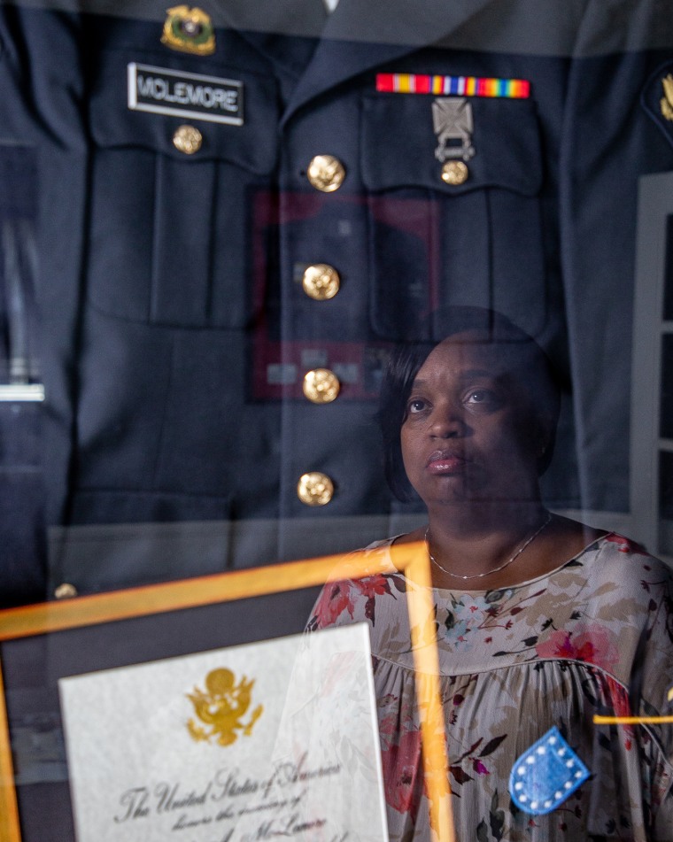 Carolyn McLemore with mementos of her son, Calyn McLemore, who died during an Army Reserve training exercise in June 2018