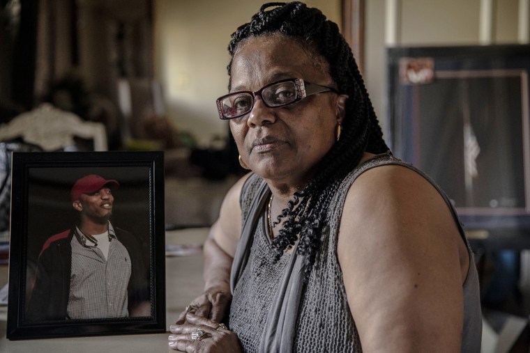 Image: Shirley Cline with a photo of her son, Sgt. Sylvester Cline, who died in June 2016 during a training exercise.