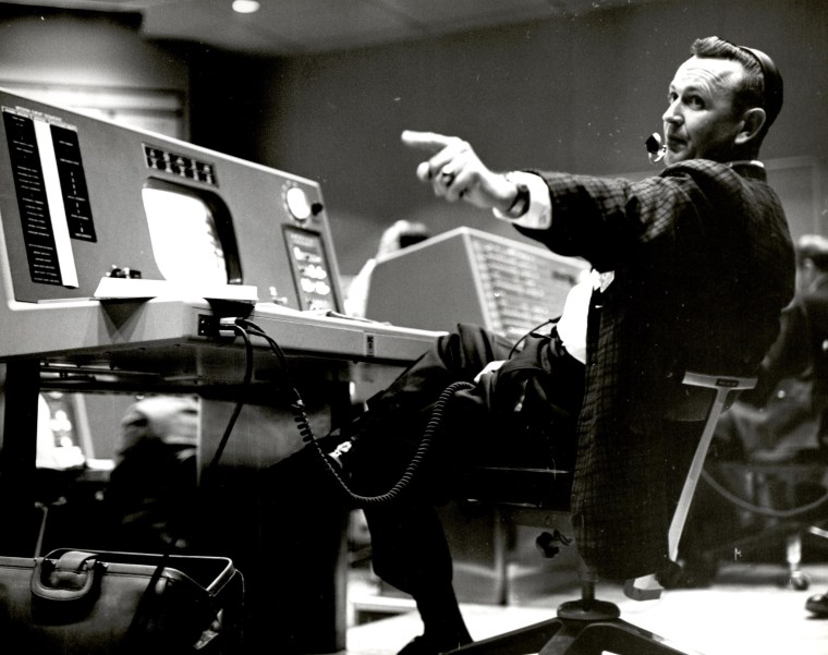 Christopher Kraft works at his console inside the Flight Control area at Mercury Mission Control, in Houston.