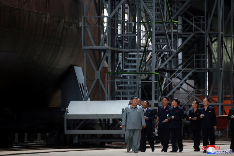 Image: North Korean leader Kim Jong Un visits a submarine factory in an undisclosed location, North Korea