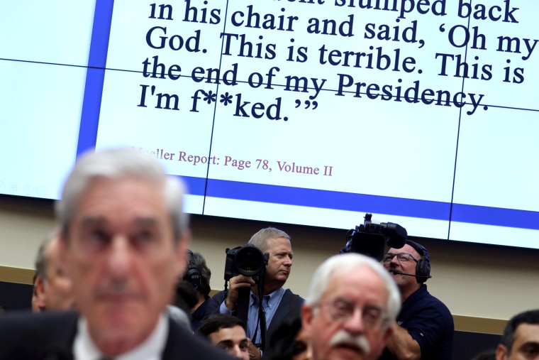 Image: Testimony appears on a television screen as former special counsel Robert Mueller testifies before the House Judiciary Committee on July 24, 2019.