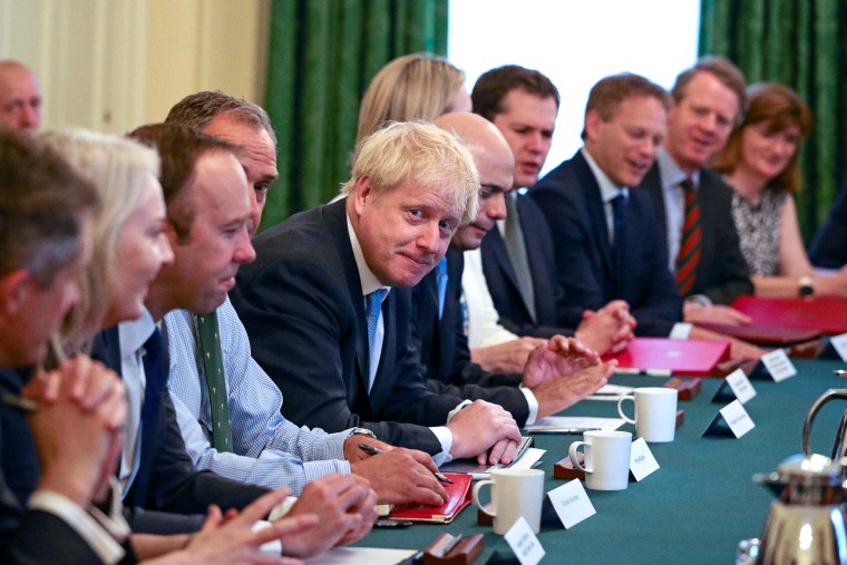 Image: Boris Johnson and members of his government during his first Cabinet meeting as prime minister on Thursday. 