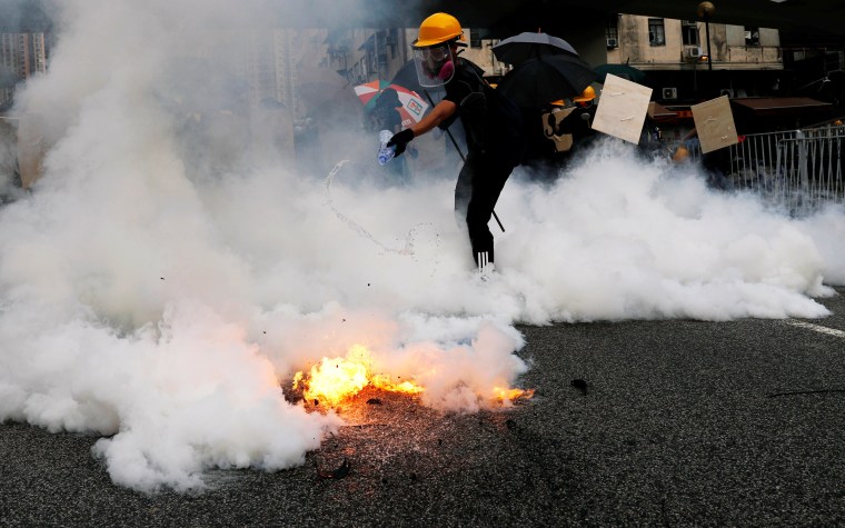 Demonstrators march to protest against in Yuen Long