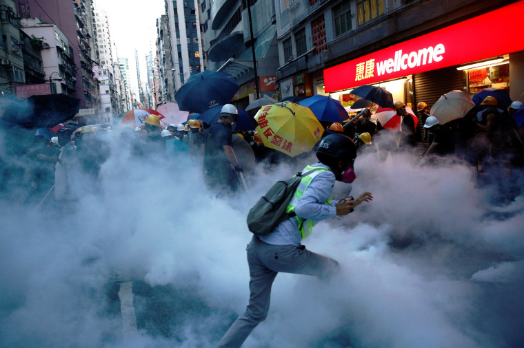 Image: Demonstrators clash with police during a protest against police violence, near China's Liaison Office in Hong Kong.