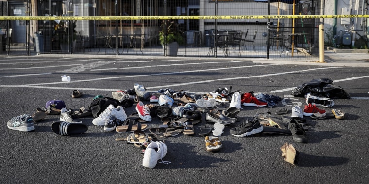 Shoes are piled outside the scene of a mass shooting in Dayton, Ohio on Aug. 4, 2019.