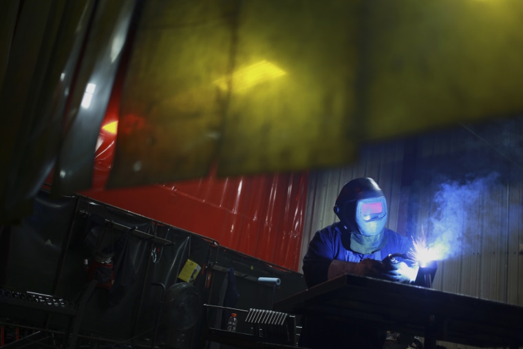 Image: A welder works during production at the Life Fitness manufacturing facility in Falmouth, Kentucky, on April 9, 2015.