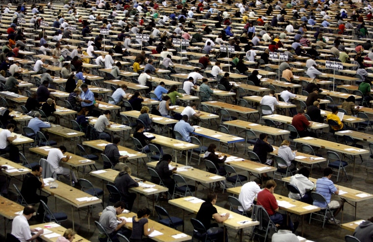 Image: Students take their bar exams at the Tampa Convention Center in Florida in 2007.