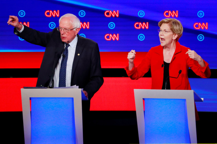 Image: Senators Sanders and Warren speak on the first night of the second 2020 Democratic U.S. presidential debate in Detroit, Michigan, U.S.
