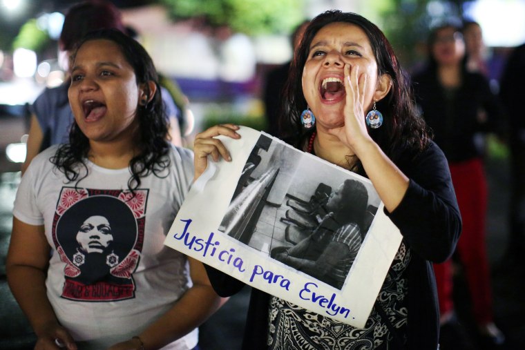 Image: Women participate in a demostration in support of Evelyn Hernandez who was sentenced to 30 years in prison for a suspected abortion in San Salvador