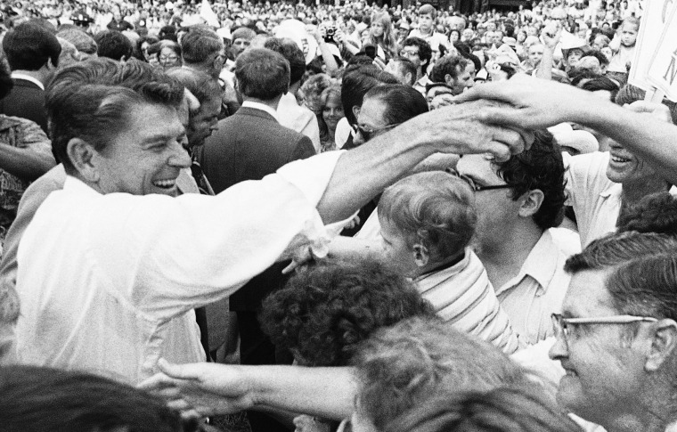 Republican presidential candidate Ronald Reagan moves through the crowd shaking hands at the Neshoba County Fair