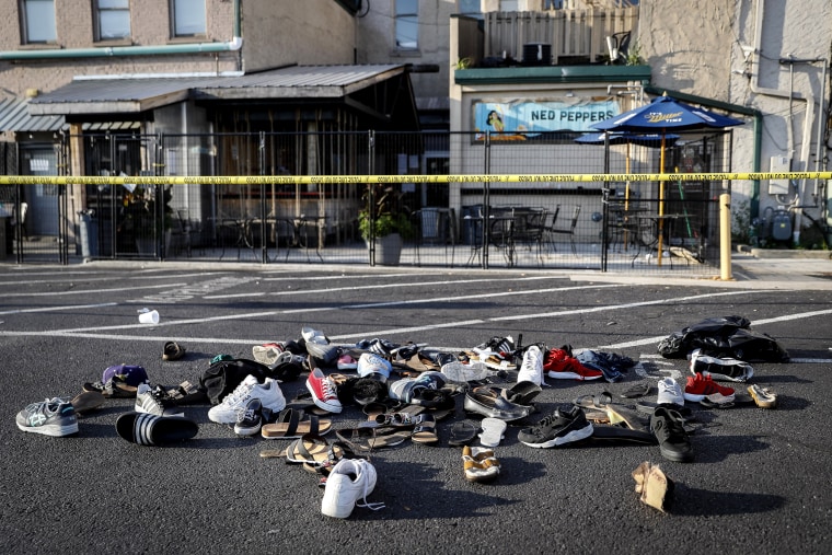 Image: A pile of shoes outside the scene of a mass shooting at Ned Peppers bar in Dayton, Ohio, on Aug. 4, 2019.