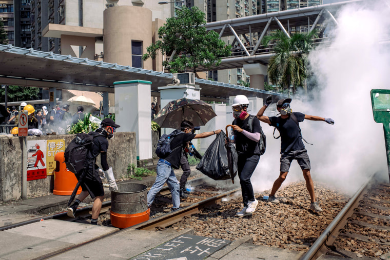 Image: Protesters get hit with tear gas