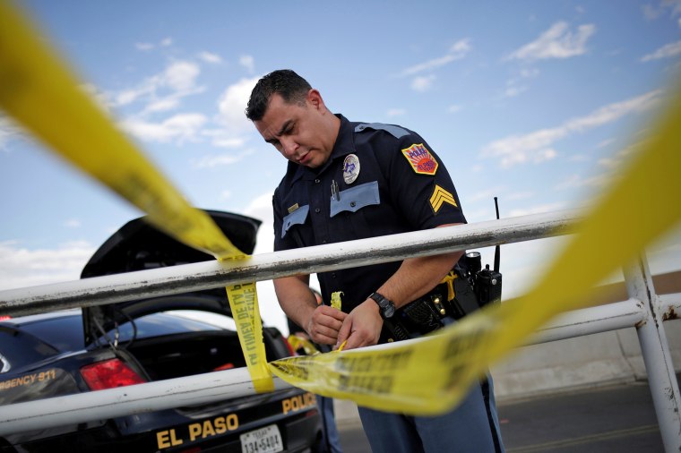 Image: A police cordon is seen after a mass shooting at a Walmart in El Paso