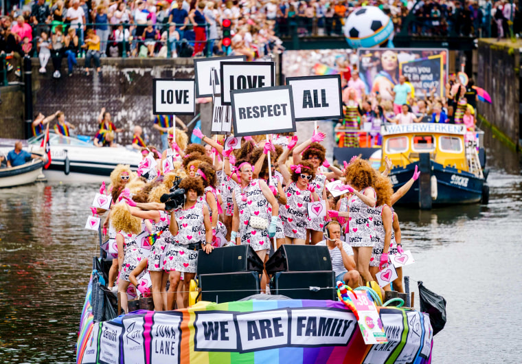 Image: People celebrate during the annual Canal Parade, a boat parade part of Amsterdam Gay Pride, in the Netherlands on Aug. 3, 2019.