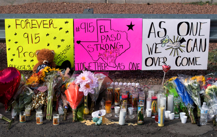 Image: Flowers and signs at a makeshift memorial for the victims of a mass shooting in El Paso, Texas, on Aug. 5, 2019.