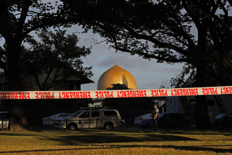Image: A police officer stands guard in front of the Masjid Al Noor mosque in Christchurch, New Zealand