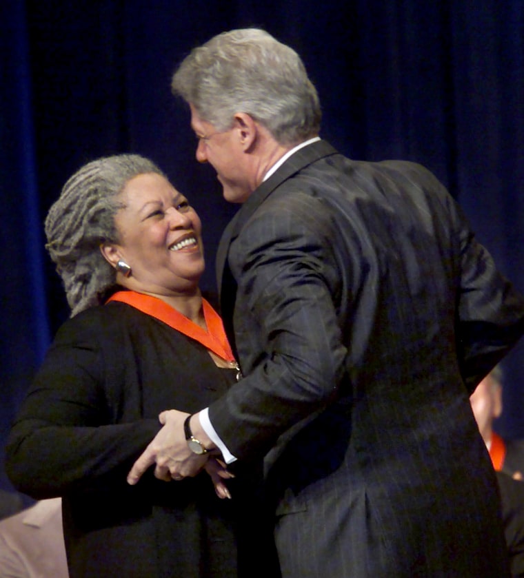 Image: President Bill Clinton embraces Toni Morrison after awarding her a National Humanities Medal in 2000.