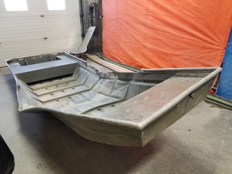 Image: A damaged aluminum boat, recovered from the shores of the Nelson River by Royal Canadian Mounted Police searching for fugitive murder suspects Kam McLeod and Bryer Schmegelsky, Sundance, Manitoba