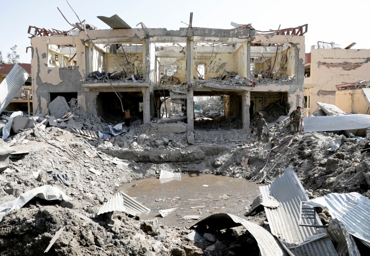 Image: Afghan National Army soldiers inspect a blast site in Kabul on Aug. 7, 2019.