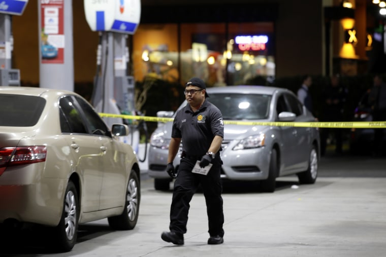 Garden Grove police work the scene of a stabbing in Garden Grove, Calif., Wednesday, Aug. 7, 2019. A man killed multiple people and wounded others in a string of robberies and stabbings in California's Orange County before he was arrested, police said Wednesday.