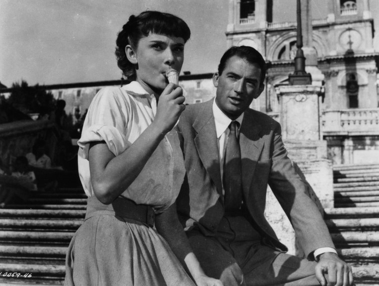 Image: Audrey Hepburn and Gregory Peck sit on the Spanish Steps in a scene from the film 'Roman Holiday', 1953.
